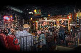 Crowd enjoying a live band performing at Chicora Alley