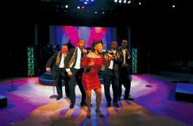 A live band performs onstage at Centre Stage in Greenville, SC.