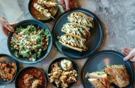 A variety of Mediterranean-inspired cuisine on a table in Paloma in downtown Greenville, SC.