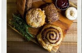 A Polaroid photo of breads and pastries from Upcountry Provisions in Travelers Rest, SC.