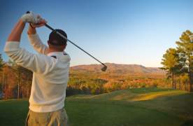Man teeing off at Cherokee Valley Golf Course
