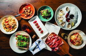 A delectable-looking table full of mouthwatering food at Jianna, an Italian restaurant in downtown Greenville, SC.