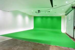 Large Green Screen room with one wall and floor covered in green screen material, remaining white walls and ceiling are brightly lit at FishEye Studios