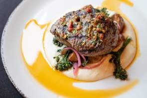 Steak dinner with potato puree and vegetables at Soby's New South Cuisine