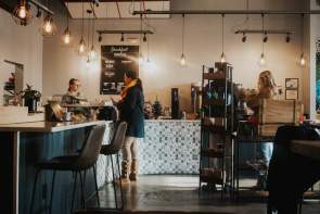 The cozy, well-lit interior of Unlocked Coffee Roasters in Greenville, SC.