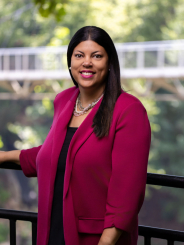 Lori Dobbins headshot in Falls Park on the Reedy on a sunny summer day
