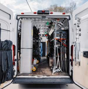 Film and production equipment in an industrial van with the back doors open