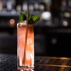 A pink cocktails looks tempting at speakeasy Vault & Vator in downtown Greenville, SC.