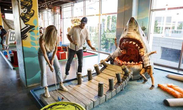 Group Therapy is a pub and playground offering experiential entertainment and the first and only indoor venue to offer a cocktail bar with a full food menu, an 18 hole wacky mini golf course, ice curling, ping pong, axe throwing, and tons of backyard games.
