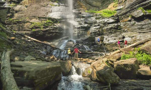 Friends bask in the grandeur of Rainbow Falls