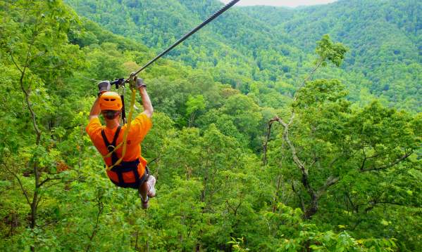 Man ziplining at The Gorge Zipline Canopy Tour