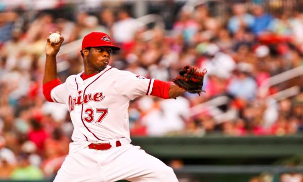 Greenville Drive pitcher throwing the ball at Fluor Field.
