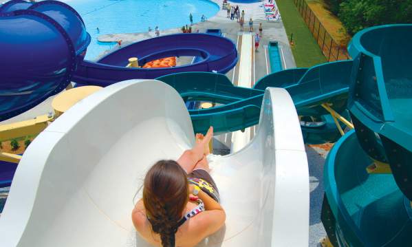 A girl gets ready to go down a body slide at Otter Creek Waterpark in Greenville, SC.