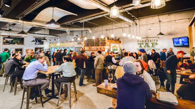 Interior view of patrons talking amongst themselves at the Community Tap.