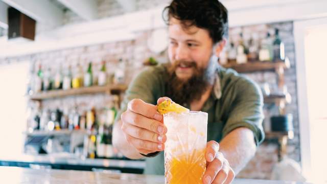 Bartender serving drink at The Anchorage