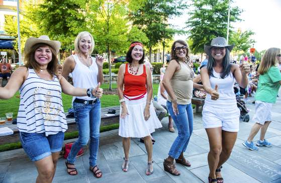 A group of ladies having a fun time dancing in the streets!