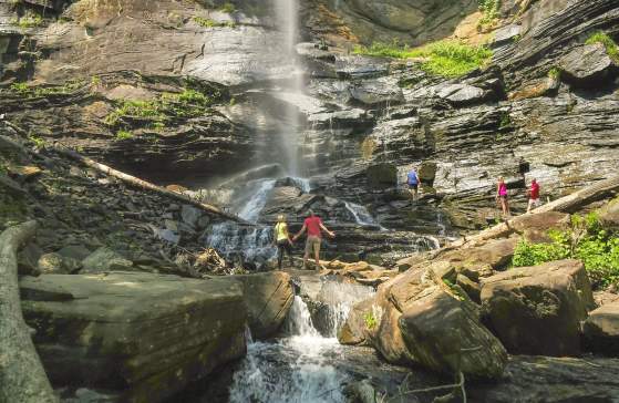 Friends bask in the grandeur of Rainbow Falls