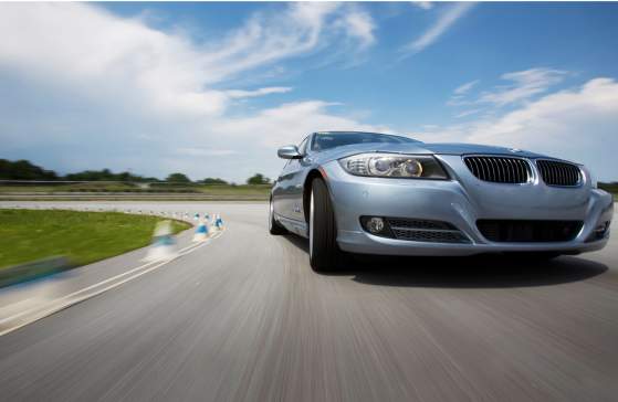 Silver BMW on the road course at the BMW Performance Driving School in Greenville, SC.