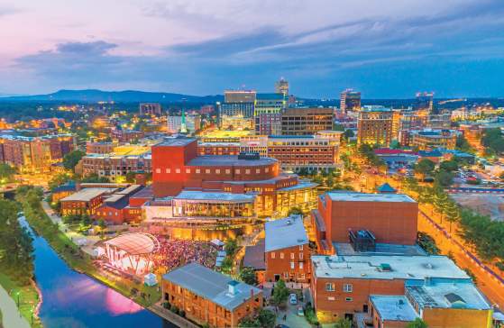 Aerial view of a city with bright lights