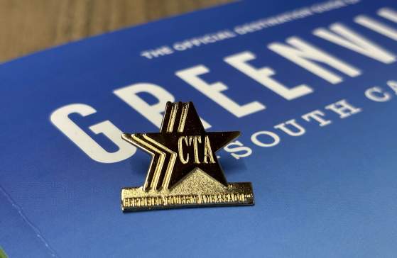 Certified Tourism Ambassador Pin. VGSC Guide in background