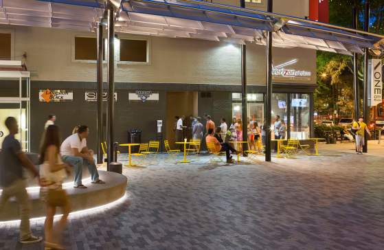 People walking in ONE City Plaza in Greenville, SC.