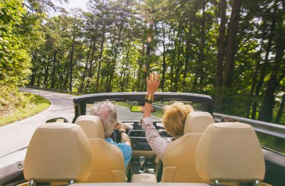 Couple Driving Convertible up to Caesars Head