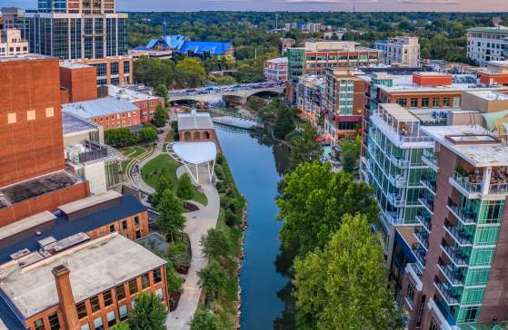 Aerial view of Reedy River overlooking Embassy Suites Downtown RiverPlace, Huguenot Loft and the TD Amphitheater