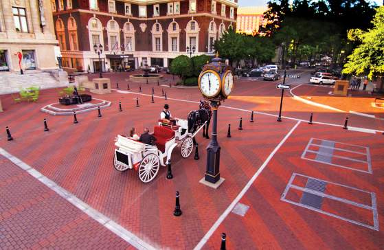 Horse drawn carriage on brick street in Greenville, SC.