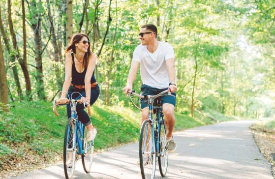 Couple Riding Along Swamp Rabbit Trail