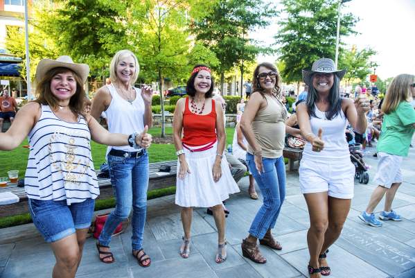 A group of ladies having a fun time dancing in the streets!