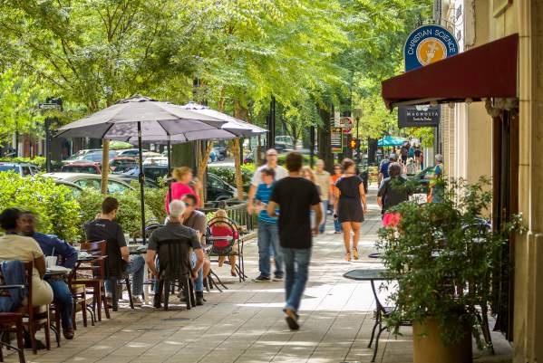 Outdoor dining and shopping on downtown Greenville’s quaint and charming Main Street.