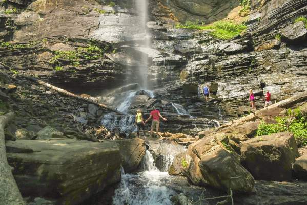 Friends bask in the grandeur of Rainbow Falls