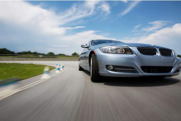 Silver BMW on the road course at the BMW Performance Driving School in Greenville, SC.