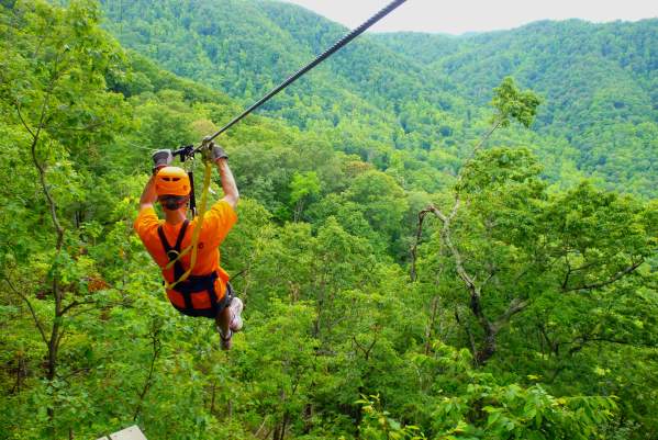 Man ziplining at The Gorge Zipline Canopy Tour