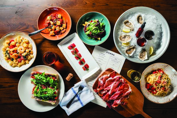 A delectable-looking table full of mouthwatering food at Jianna, an Italian restaurant in downtown Greenville, SC.