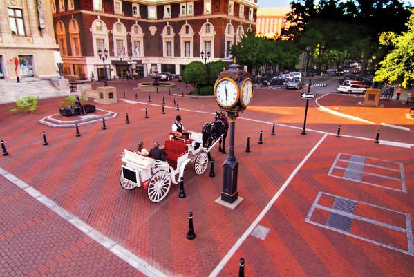 Horse drawn carriage on brick street in Greenville, SC.