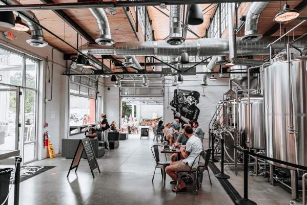 People sitting in Liability Brewing Co.