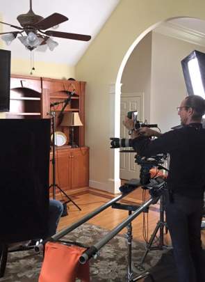 Film equipment from Greenville Production Services being used by a film crew in a home setting