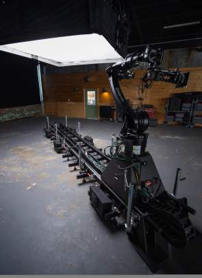 Studio 2 at CR8 with camera equipment on a track and overhead bright light.