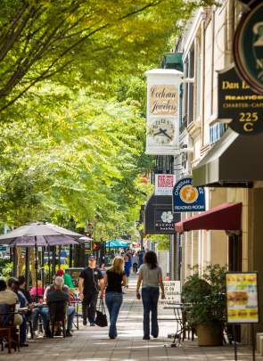 Outdoor dining and shopping on Main Street in downtown Greenville.