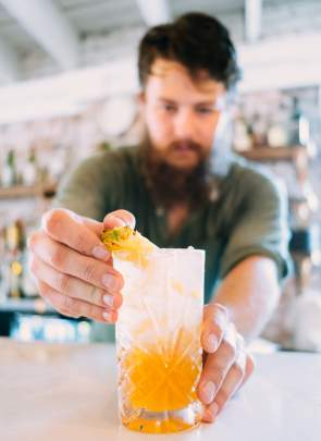 The Anchorage restaurant bartender making cocktail
