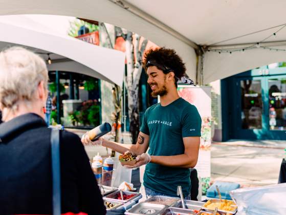 Man making food at Fall for Greenville 2018