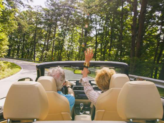 Couple Driving Convertible up to Caesars Head