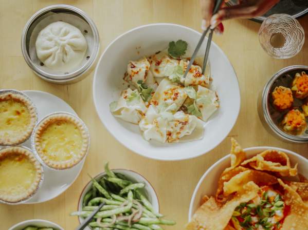 Multiple plates of food at Sum Bar