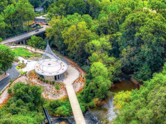 Surrounded by its lush greenery and nestled in between the Reedy River sits Cancer Survivors Park. Beautiful from every angle but even more breathtaking when seen from above.