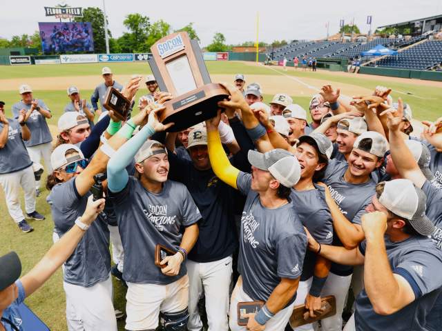 Team holding up trophy