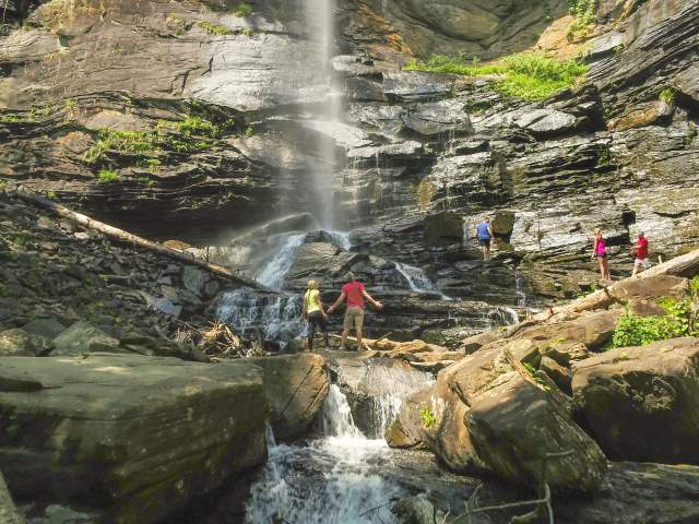 Friends bask in the grandeur of Rainbow Falls