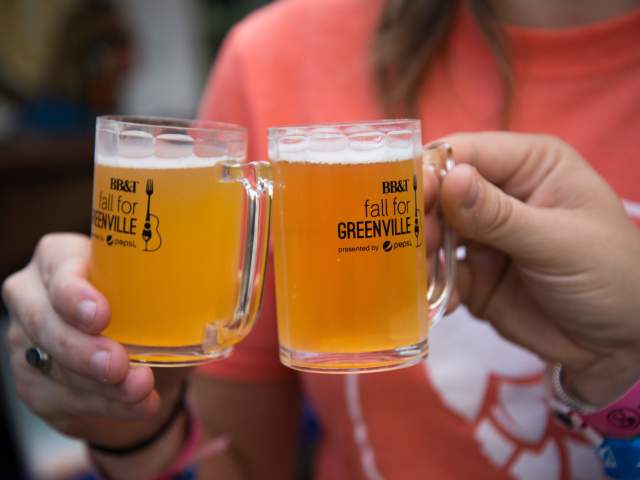 People toasting beer at Fall for Greenville 2017