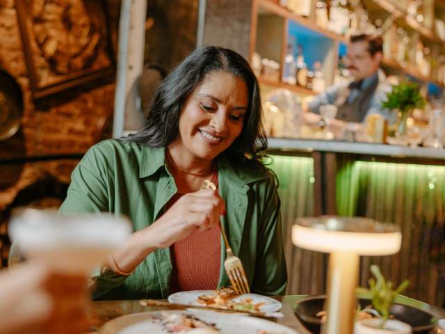 A woman eats appetizers at The Rabbit Hole cocktail bar in Greenville, SC.