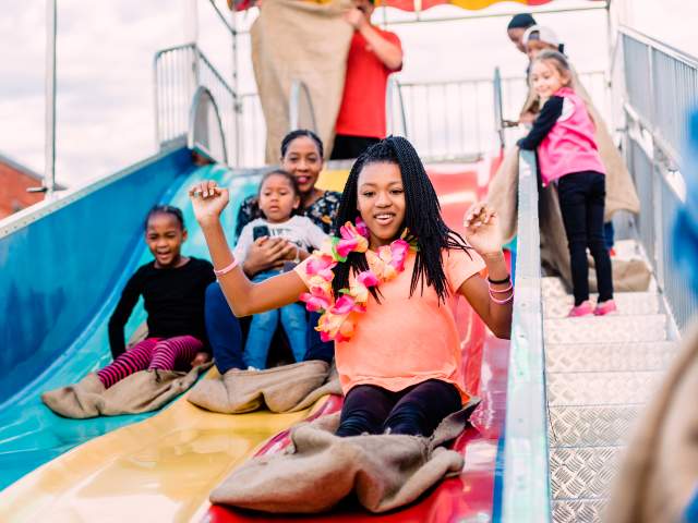 Kids going down slide at Fall for Greenville 2018